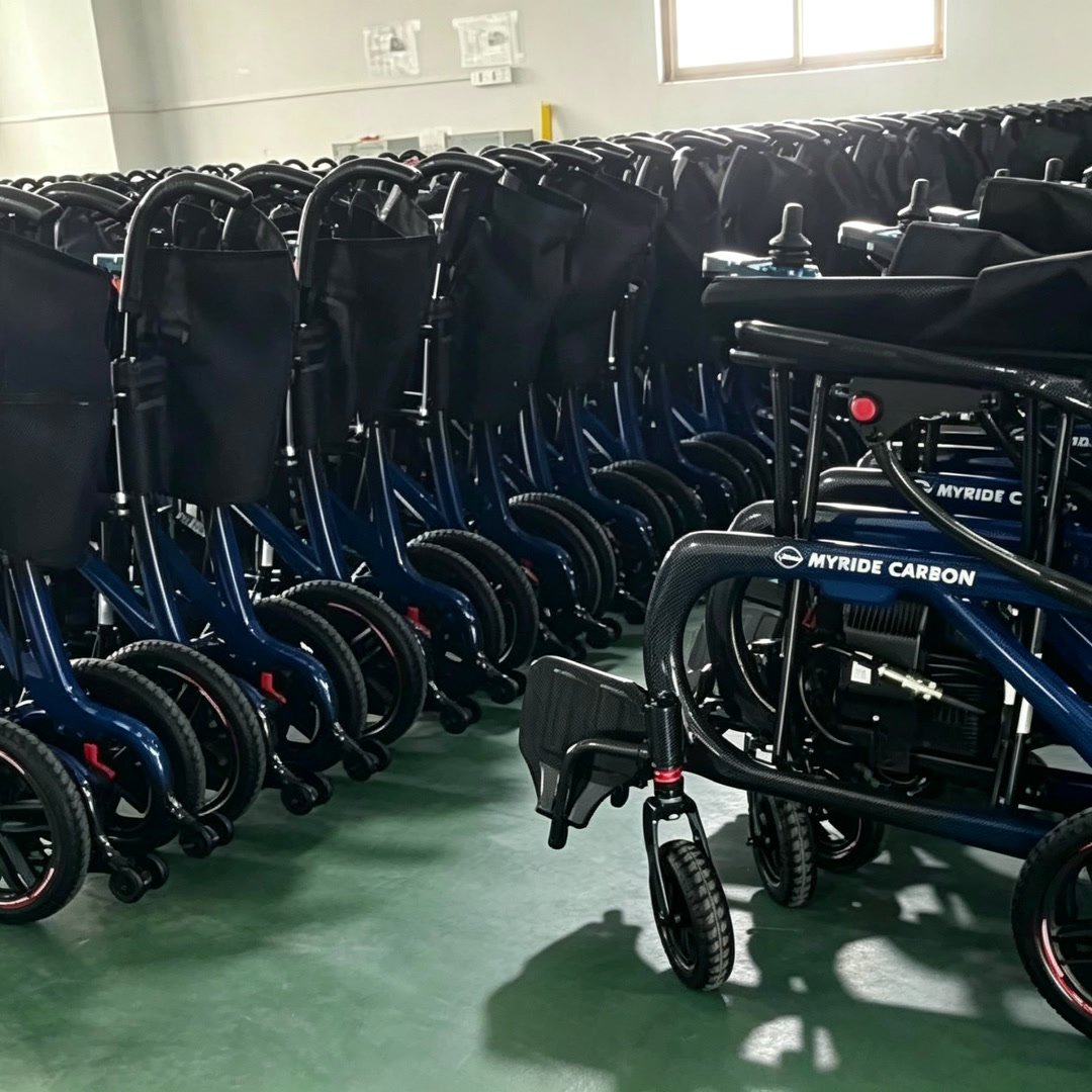 Rows of electric wheelchairs prepared for order review