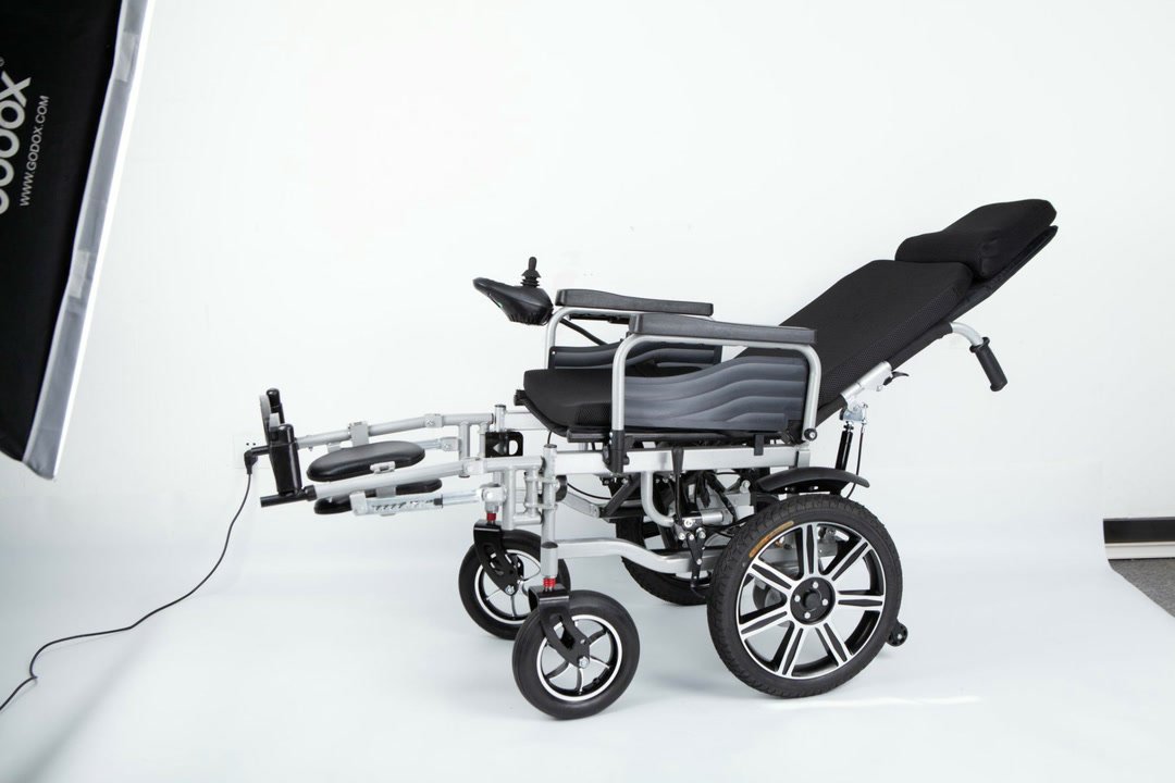 Reclining nursing wheelchair shown in a studio side view