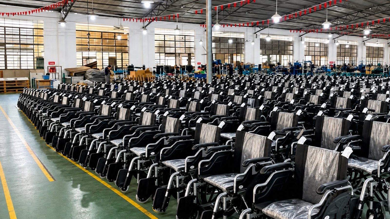Rows of finished manual wheelchairs across the SANYANG production hall